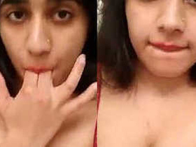 Desi babe in red lingerie reveals her seductive body and pleasures herself on camera