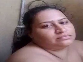 Busty Indian bhabhi films herself in the bathroom