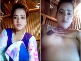 Desi hottie flaunts her breasts in a sizzling solo performance