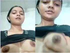 A sweet webcam girl flaunts her breasts in front of the camera