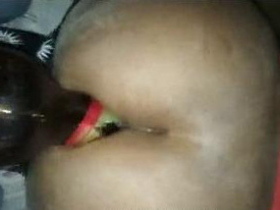 Bhabhi's main focus is on beer bottle