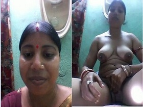 Bagla Budi's intimate striptease and revealing of her breasts and vagina