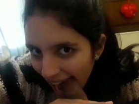 Beautiful girl satisfies her boyfriend's desires with oral pleasure