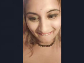 Busty college girl flaunts her assets in a naughty video