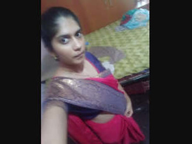 Desi girl flaunts her large breasts in a video