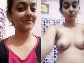Cute solo girl shows off her breasts on cam