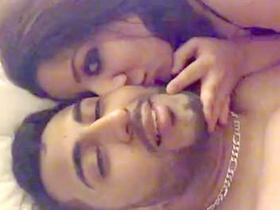 Young couple enjoys passionate sex on the bed in bedroom