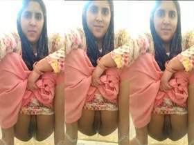 Naughty Indian bhabhi takes a pee in a public bathroom