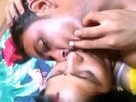 Rustic couple's sensual foreplay in a log cabin