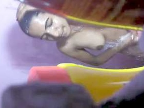 Sorna, a Desi girl, sneaks a peek at the bathroom in a video