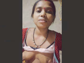 Desi bhabhi from the countryside fondles her boobs in a steamy video