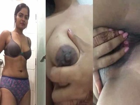 A stunning and seductive woman films a video in the bathroom