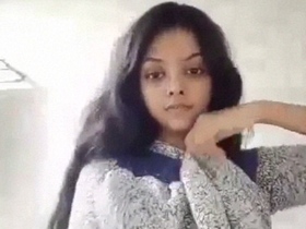 Desi beauty strips naked in the bathroom and teases in a solo video