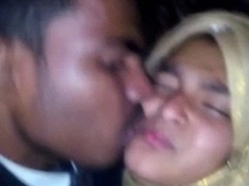 Young lovers share a passionate kiss in amateur video