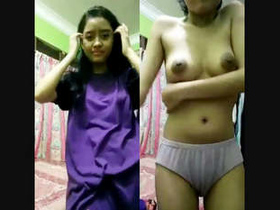 Schoolgirl flaunts her boobs and pussy in a steamy video
