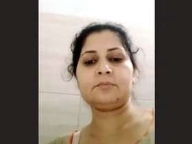 Indian bhabhi pleasures herself with her fingers in a seductive manner