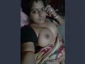 Busty babe Indiana Boudi flaunts her assets in a solo video