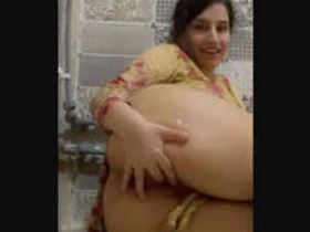 Tiny babe masturbates with her fingers and shows off