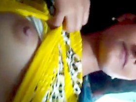 A cute Indian girl in yellow chudidhar flaunts her breasts