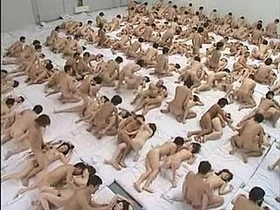 Watch as a group of Japanese athletes engage in a wild orgy in this explicit video