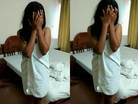 Shy Indian girl hides her face in embarrassment