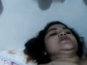 Indian XXX threesome video featuring a curly-haired bhabha and two men engaging in oral sex and sexual intercourse