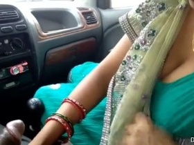 Mature Indian woman gives a blowjob in the car