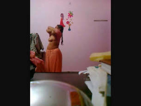 Secretly recorded video of an older woman's sari removal