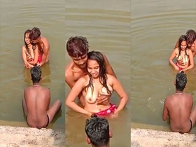 Desi Indian girl takes a nude bath with a group of boys in the outdoors