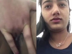 Young girl pleasures herself with her fingers