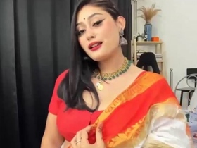 Cute Anna in an orange saree enjoys some fun with herself