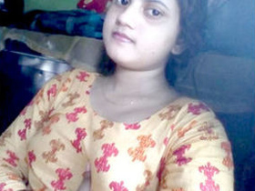 Bhabi from a Desi village teases with her big boobs and fingers her pussy