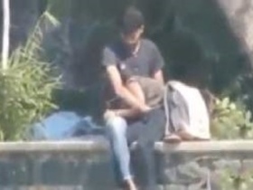 College girl gives a blowjob to her lover in a public place