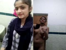 College girl shows off her body in a seductive striptease