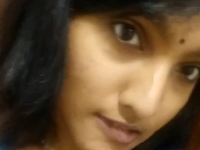 Nude Indian girl exposes her bare breasts in a solo video