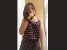 A pretty girl from the northeast slowly undressing