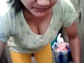 Busty aunty washes clothes with her big boobs hanging out