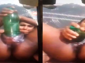 Local girl enjoys a solo masturbation session with a big bottle