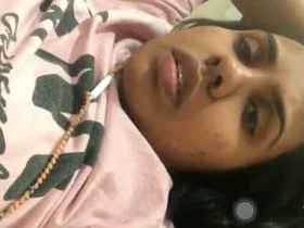 A young college girl flaunts her breasts in a video call
