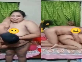 Big-breasted auntie indulges in hardcore village sex with her young roommate