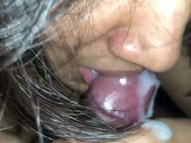 A seductive Indian woman gives a close-up blowjob and swallows the cum