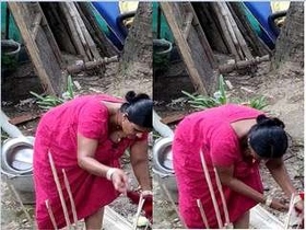 Desi babe's boobs on full display while cleaning clothes