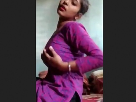 Horny girl pleasures herself in front of camera