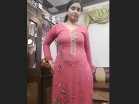 Watch a Pakistani man in a striped suit get naughty in this video