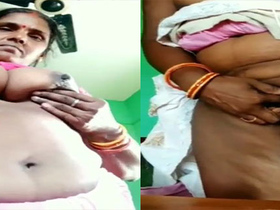 Mature village aunty flaunts her big tits and pussy on camera
