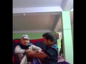 Pakistani teen with hijab plays with her breasts and gets them sucked