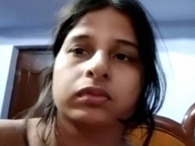 A stunning Bengali woman strips and captures her nude body on video