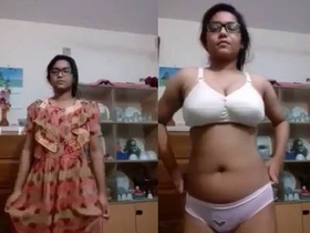 A charming young woman gets naked and teases in front of the camera