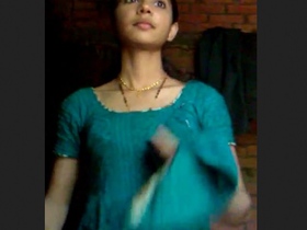 A young girl in village seductively strips and teases