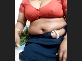 Mature aunty in a blouse gets wild on camera